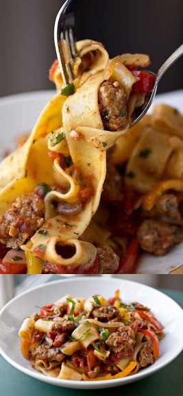 Saucy Italian Drunken Noodles with Spicy Italian Sausage, Tomatoes and Caramelized Onions and Red and Yellow Bell Peppers, with Fresh Basil