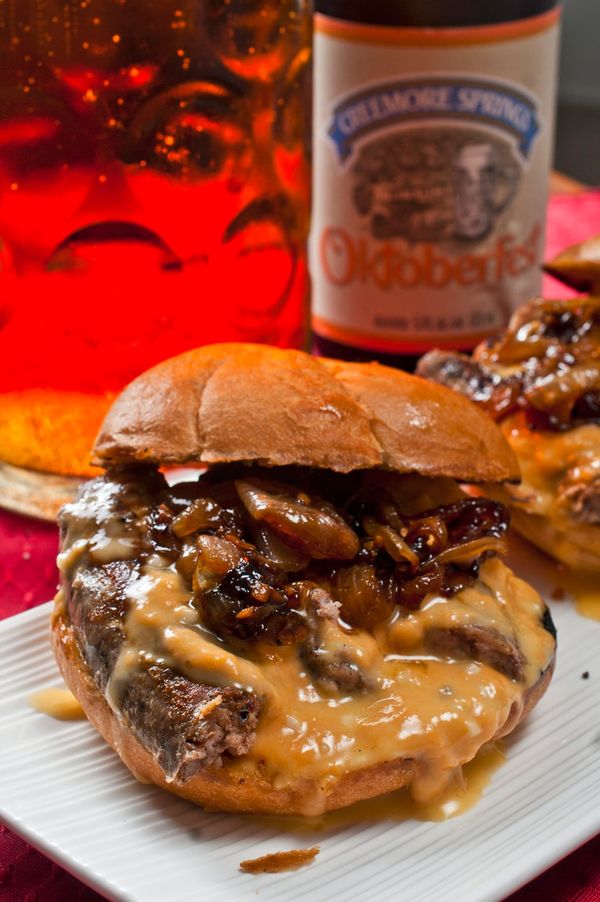 Bratwurst sandwich with beer braised onions and beer cheese sauce