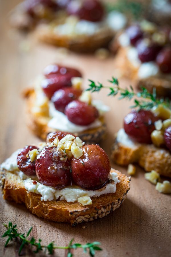 Roasted grape crostini with goat cheese and waluts