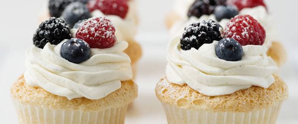 Angel Food Cupcakes with Whipped Cream and Berries