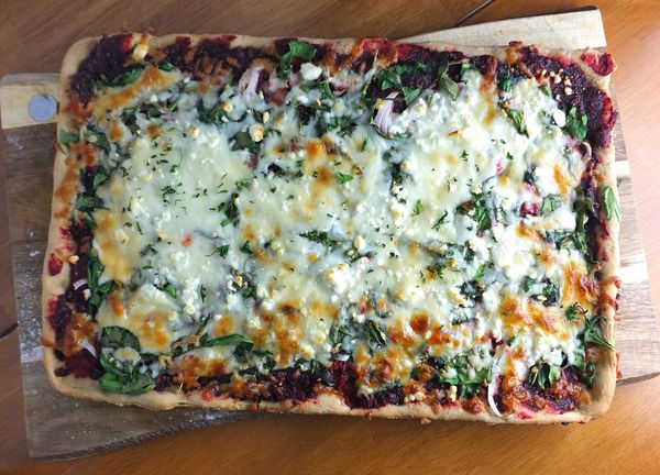 Beet pesto pizza with spinach and feta