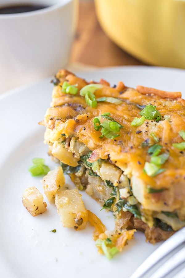 Cheesy Breakfast Bake with Crispy Bacon, Spinach, Caramelized Onions and Diced Potatoes