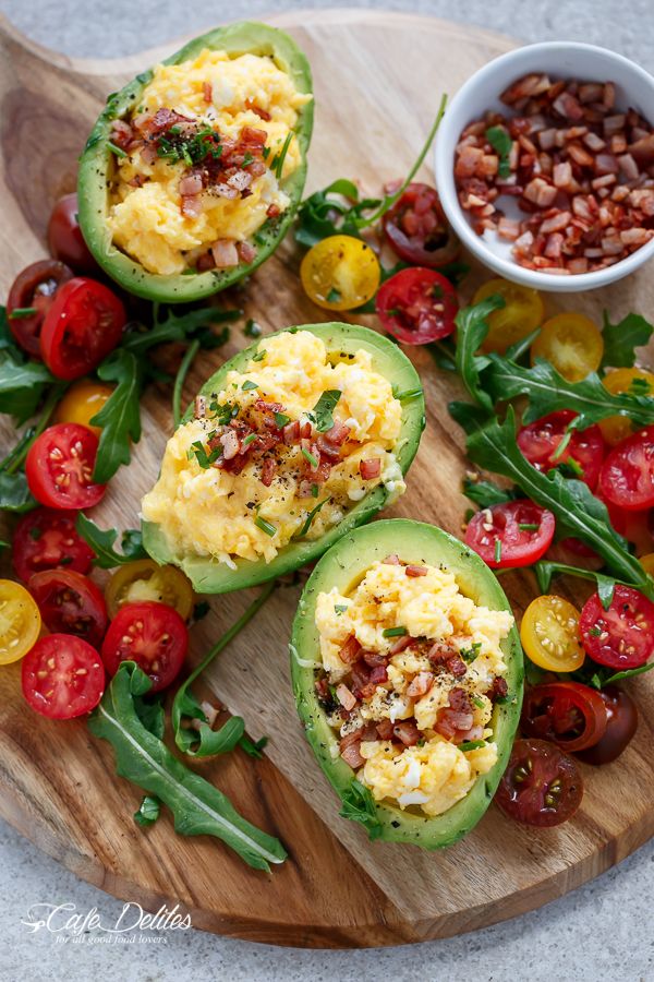 Cheesy Scrambled Eggs in Avocado With Crispy Bacon Pieces