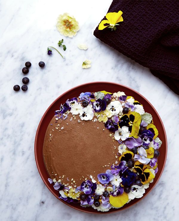 Decadent chocolate cake with edible flowers