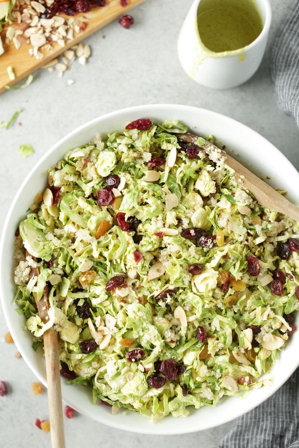 Easy shredded brussels sprouts, cranberry & quinoa salad with orange hemp dressing