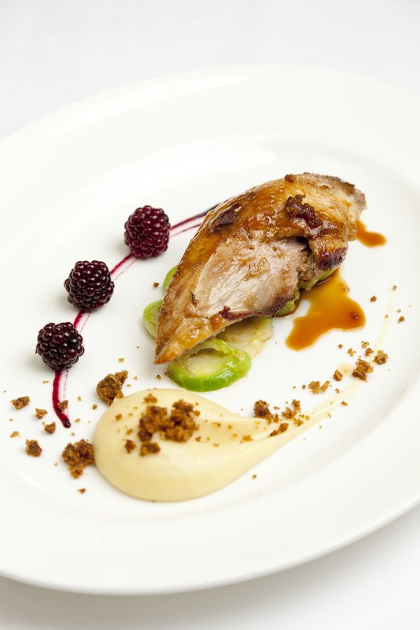 Roast pheasant breast with parsnip purée, parkin and pickled brambles