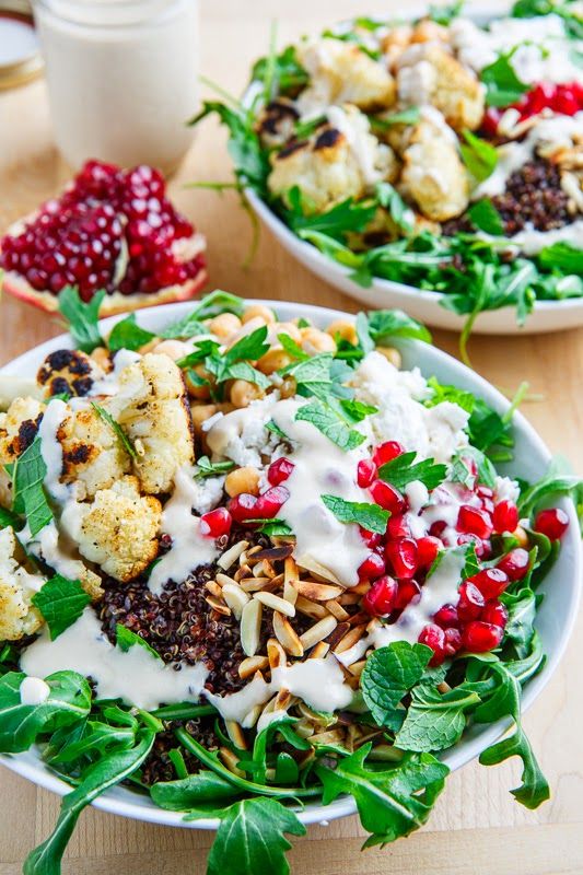 Roasted Cauliflower and Chickpea Quinoa and Arugula Salad with Almonds, Pomegranate and Feta in a Lemony Tahini Dressing