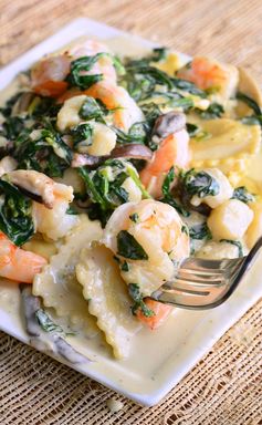 Ravioli with Seafood, Spinach & Mushrooms in Garlic Cream Sauce