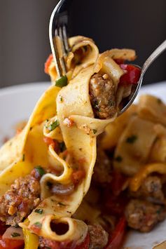Saucy Italian Drunken Noodles with Spicy Italian Sausage, Tomatoes and Caramelized Onions and Red and Yellow Bell Peppers, with Fresh Basil