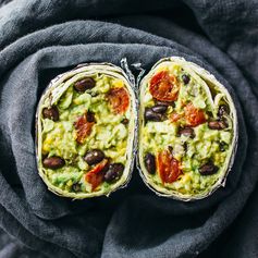 Guacamole burrito with balsamic roasted tomatoes and black beans