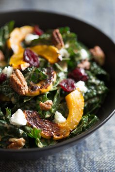 Kale salad with roasted delicata squash, chevre, dried cranberries and spiced pecans