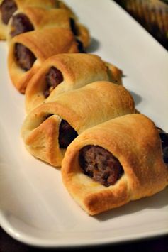 Cheese stuffed brats in a blanket