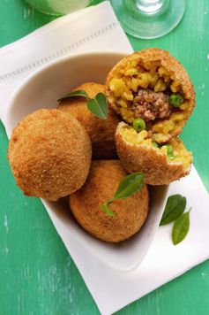 Classic Sicilian Arancini (Rice Balls Stuffed with Ragu' and Peas