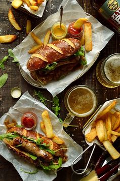 Sausages With Beer Pretzel Buns, Beer Braised Onions & Roasted Garlic Butter