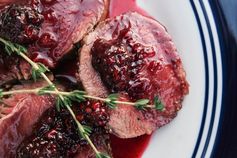 Seared venison backstrap with blackberry sauce