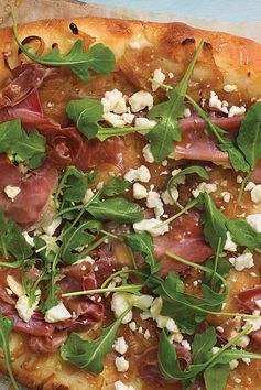 Spicy Honey Caramelized Onion Pizza with Prosciutto, Feta, and Arugula