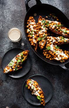 Tandoori Chickpea Stuffed Sweet Potatoes with Tahini Lime Drizzle