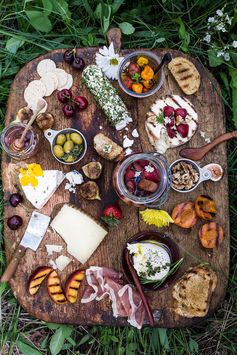 How to make a Killer Summer Cheeseboard (with pickled strawberries + Herb Roasted Cherry Tomatoes!