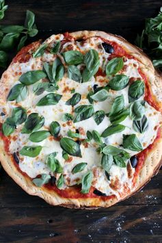 Rustic black olives and heirloom tomatoes pizza