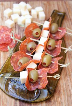 Antipasto skewers with salami, olives and mozzarella