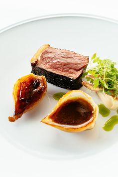 Blackened sirloin steak with salted caramel onions and parsley salad