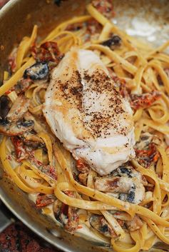 Chicken mushroom pasta with sun-dried tomatoes in a creamy garlic and basil sauce