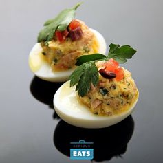 Deviled Eggs With Confit Tuna, Olives, Tomato, and Olive Oil