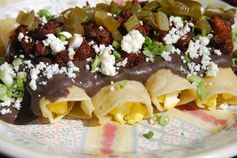 Enchiladas with Chipotle Black Bean Sauce, Chorizo and Queso Fresco