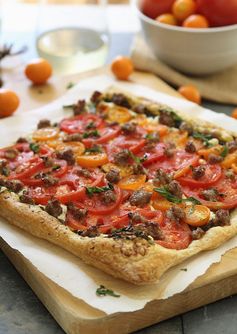 Goat cheese, tomato and sausage tart