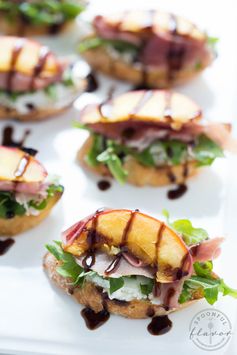 Grilled Peach Crostini with Arugula, Prosciutto and Goat Cheese