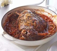 Herby baked lamb in tomato sauce