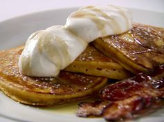 Orange Pumpkin Pancakes with Vanilla Whipped Cream, Cinnamon Maple Syrup and Thick-Cut Bacon