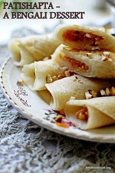 Patishapta (A Bengali Dessert, rice flour pancakes with coconut and khoya filling