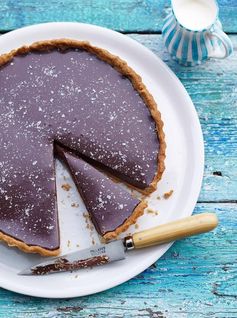 Rich chocolate tart with salt flakes